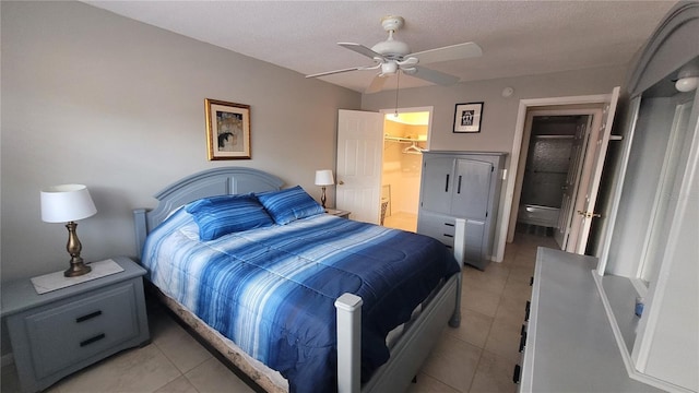 5880 38th Ave N Unit 204, Saint Petersburg, FL 33710 - tiled bedroom featuring ceiling fan, a spacious closet, and a closet