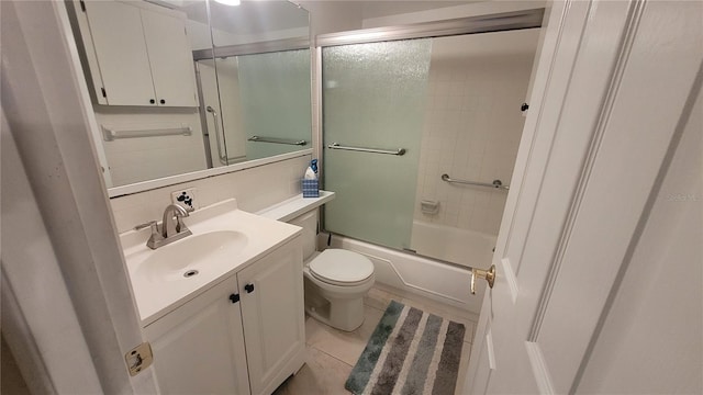 5880 38th Ave N Unit 204, Saint Petersburg, FL 33710 - full bathroom with vanity, tile patterned flooring, enclosed tub / shower combo, and toilet