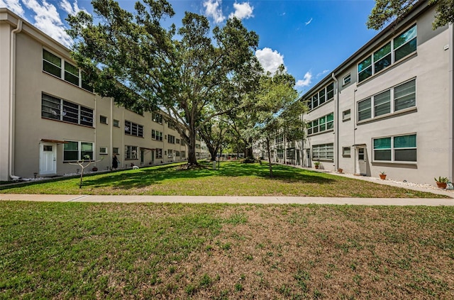 5880 38th Ave N Unit 204, Saint Petersburg, FL 33710 - view of property's community with a lawn