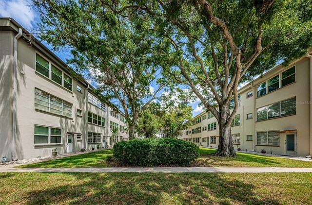 5880 38th Ave N Unit 204, Saint Petersburg, FL 33710 - surrounding community with a yard
