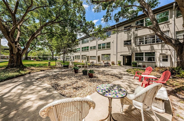 5880 38th Ave N Unit 204, Saint Petersburg, FL 33710 - view of property's community featuring a patio area