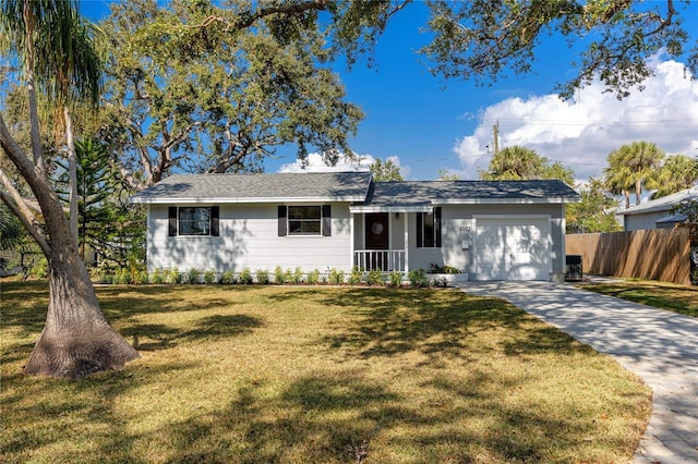 single story home with a garage and a front lawn