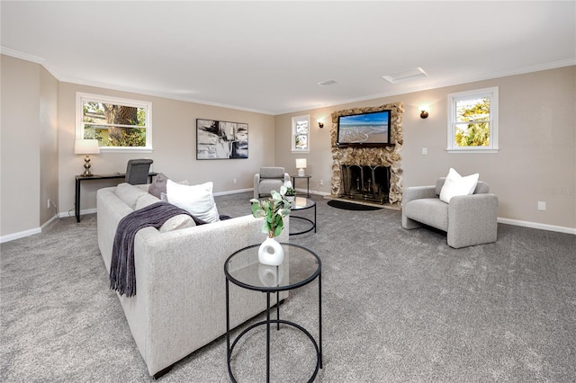 carpeted living room with a healthy amount of sunlight, ornamental molding, and a fireplace