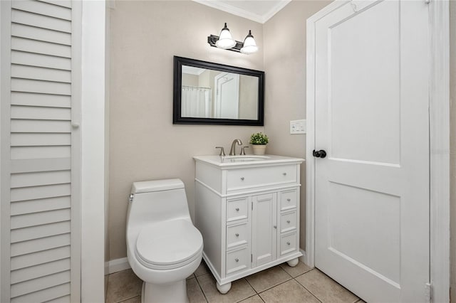 bathroom with ornamental molding, toilet, tile patterned flooring, and vanity