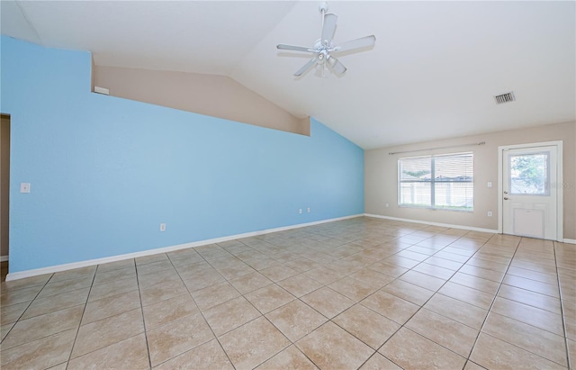 interior space featuring vaulted ceiling, light tile patterned floors, and ceiling fan