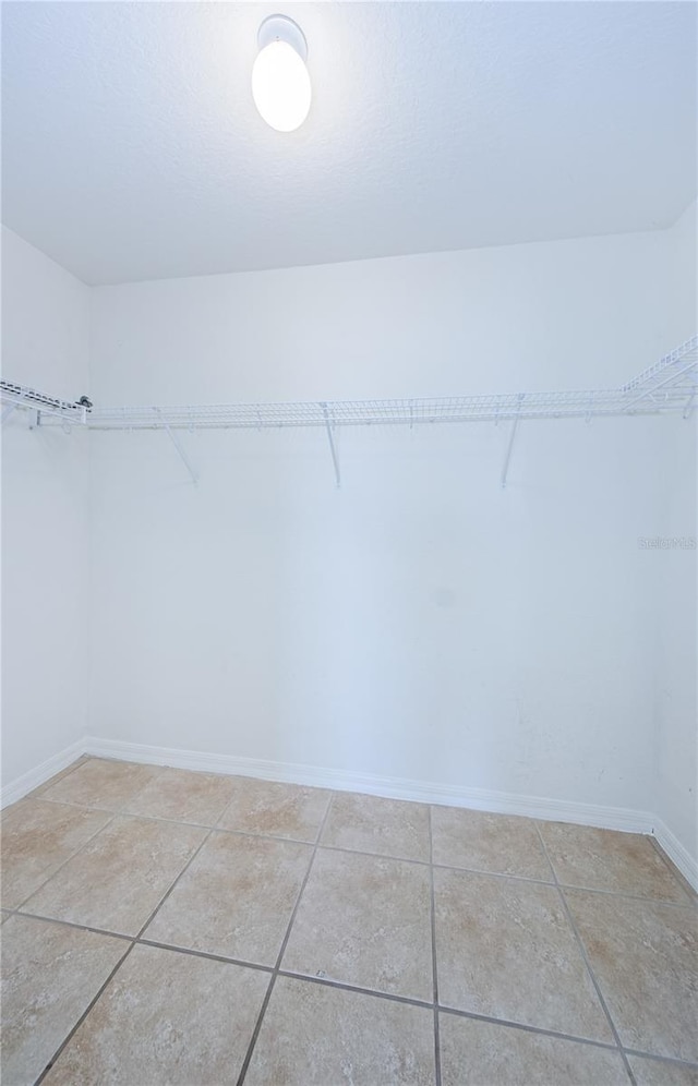 walk in closet featuring light tile patterned floors