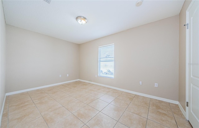 unfurnished room featuring light tile patterned floors