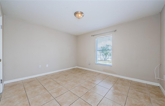 empty room with light tile patterned floors