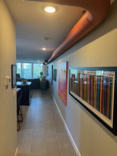 hallway featuring tile patterned floors