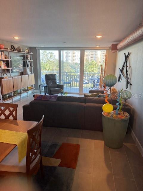 living room with light tile patterned flooring