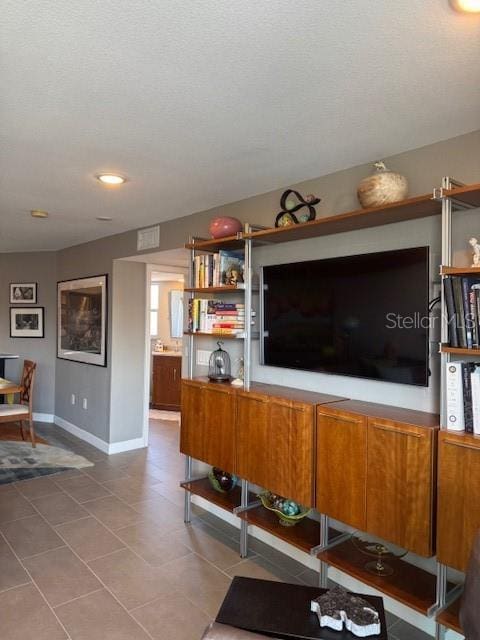 living room with tile patterned floors