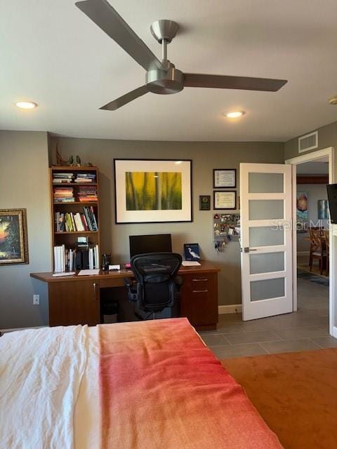 tiled bedroom with ceiling fan