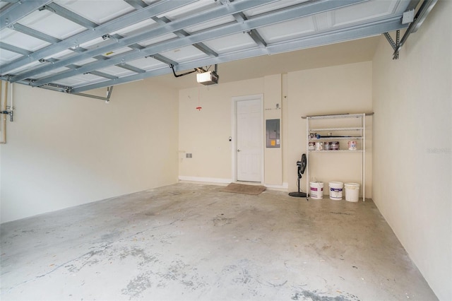 garage featuring electric panel and a garage door opener