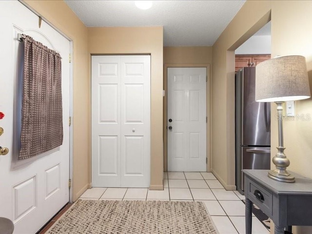 entryway featuring light tile patterned floors