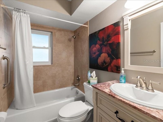 full bathroom with vanity, shower / bath combo, and toilet