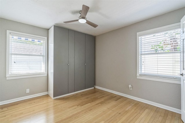 unfurnished bedroom featuring ceiling fan and light wood-type flooring