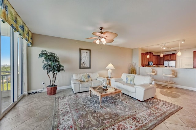 living room with light tile patterned floors and ceiling fan