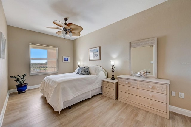 bedroom with ceiling fan and light wood-type flooring