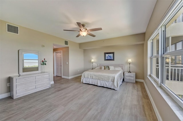 bedroom featuring ceiling fan and light wood-type flooring