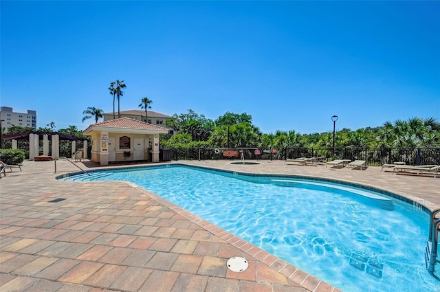 view of swimming pool featuring a patio area