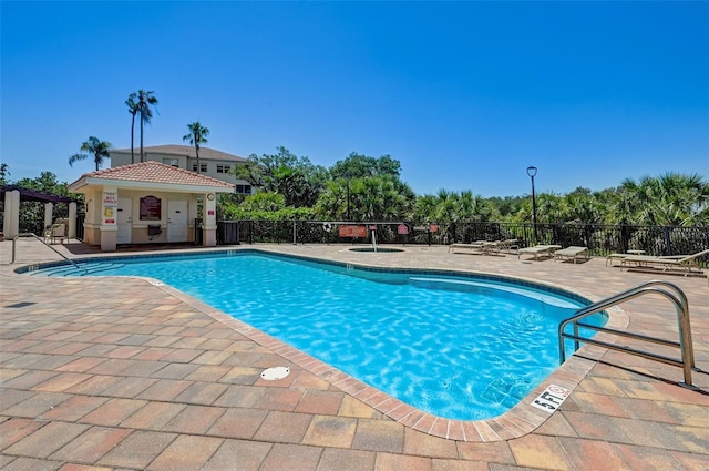 view of swimming pool with a patio and central AC unit