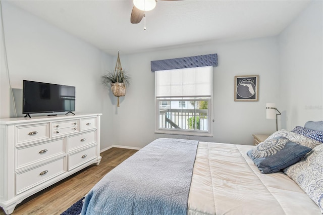 bedroom featuring hardwood / wood-style flooring and ceiling fan