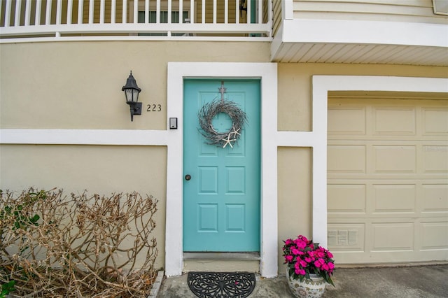 doorway to property featuring a garage