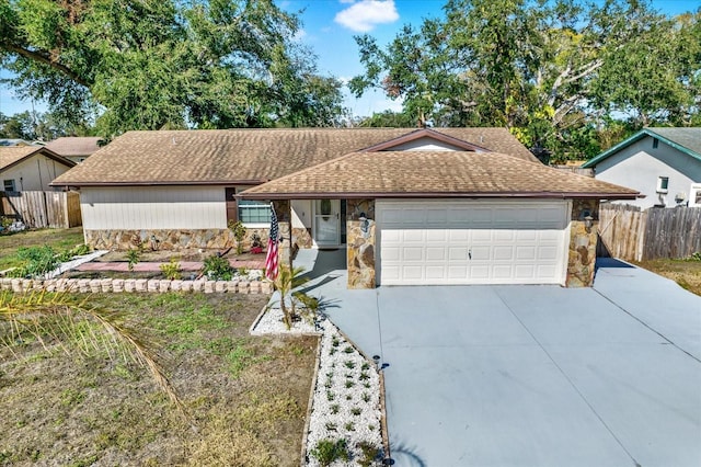 ranch-style home featuring a garage