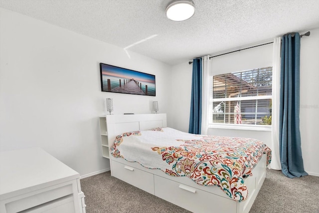 carpeted bedroom with a textured ceiling