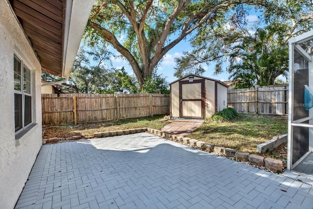 view of patio with a storage unit