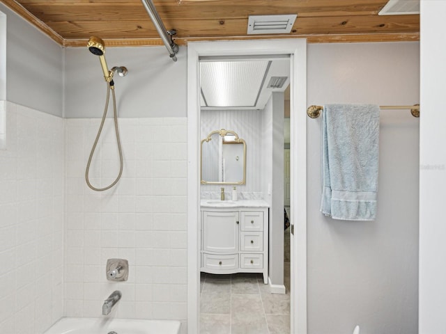 bathroom featuring vanity, visible vents, and shower / bathtub combination