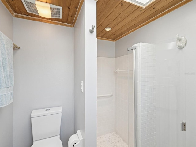 bathroom featuring toilet, visible vents, a shower stall, and wood ceiling