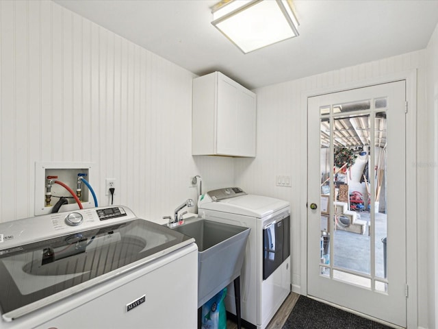 washroom with separate washer and dryer, plenty of natural light, a sink, and cabinet space