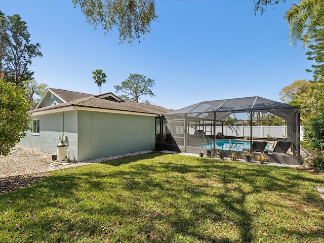 exterior space featuring a fenced in pool, glass enclosure, and fence