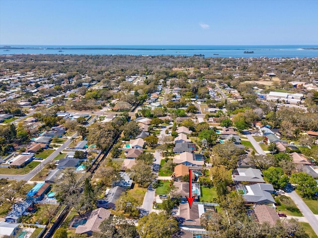 bird's eye view featuring a water view and a residential view