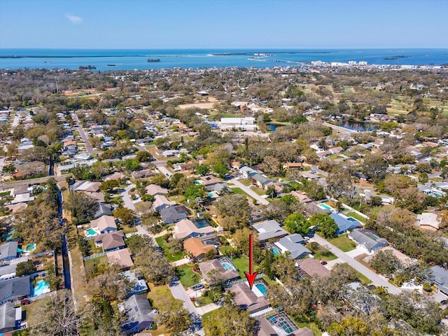 birds eye view of property featuring a water view and a residential view