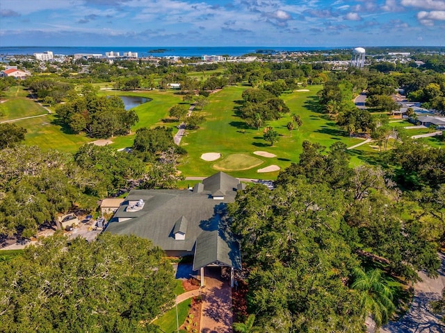 birds eye view of property featuring a water view and view of golf course