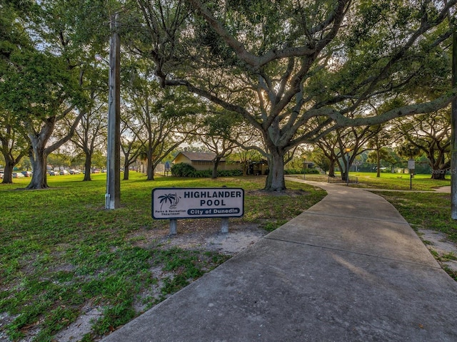 view of property's community with a yard