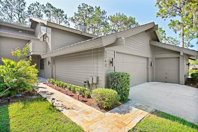 view of side of property featuring a garage