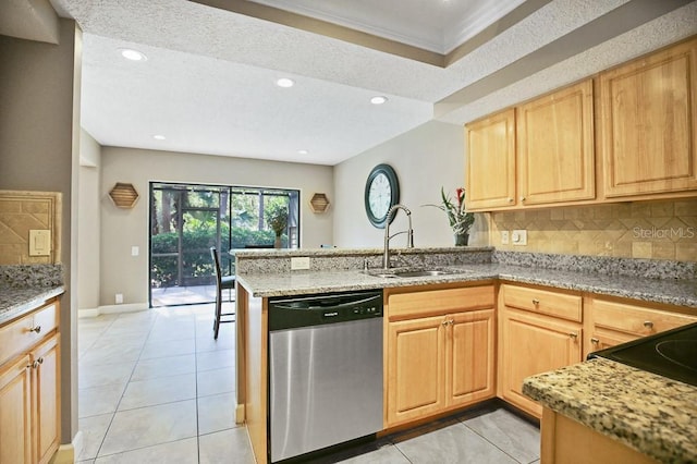 kitchen featuring dishwasher, sink, light stone counters, and kitchen peninsula