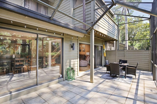 view of patio / terrace with a lanai