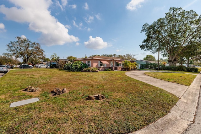 ranch-style home with a front yard