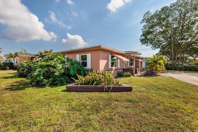 view of home's exterior featuring a yard