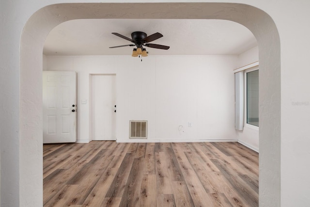 unfurnished room featuring hardwood / wood-style flooring and ceiling fan