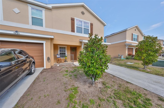 view of front of house with a garage and covered porch