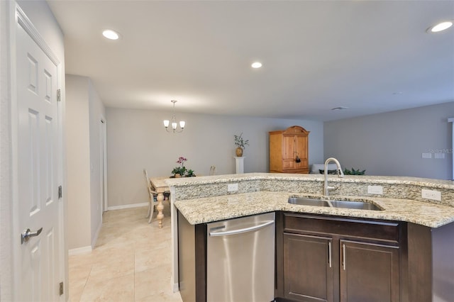 kitchen with sink, dark brown cabinetry, light stone counters, light tile patterned flooring, and stainless steel dishwasher