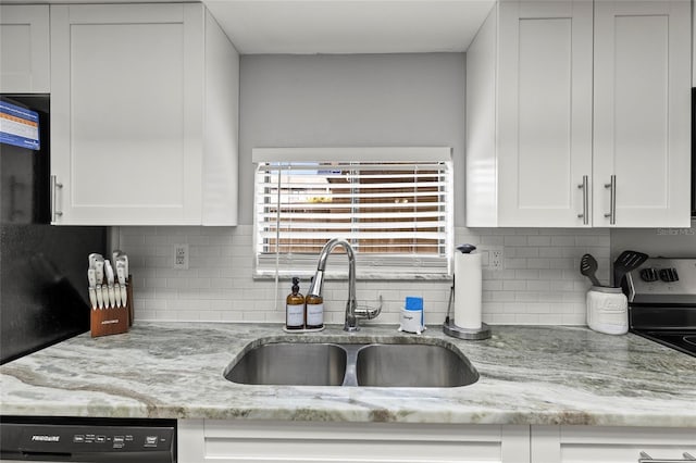 kitchen featuring dishwasher, white cabinetry, light stone countertops, and sink