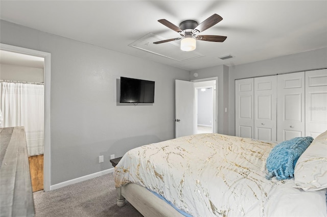 carpeted bedroom with ceiling fan and a closet