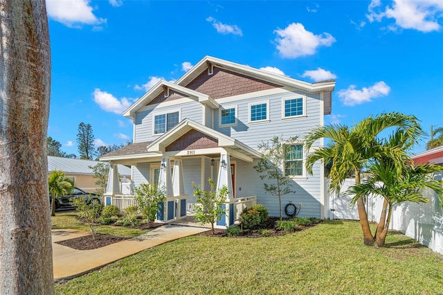 view of front facade with covered porch and a front yard