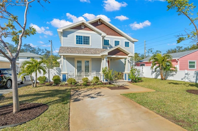 view of front facade with a front yard and a porch